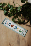 Slow Down Embroidered Banner