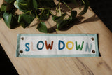 Slow Down Embroidered Banner